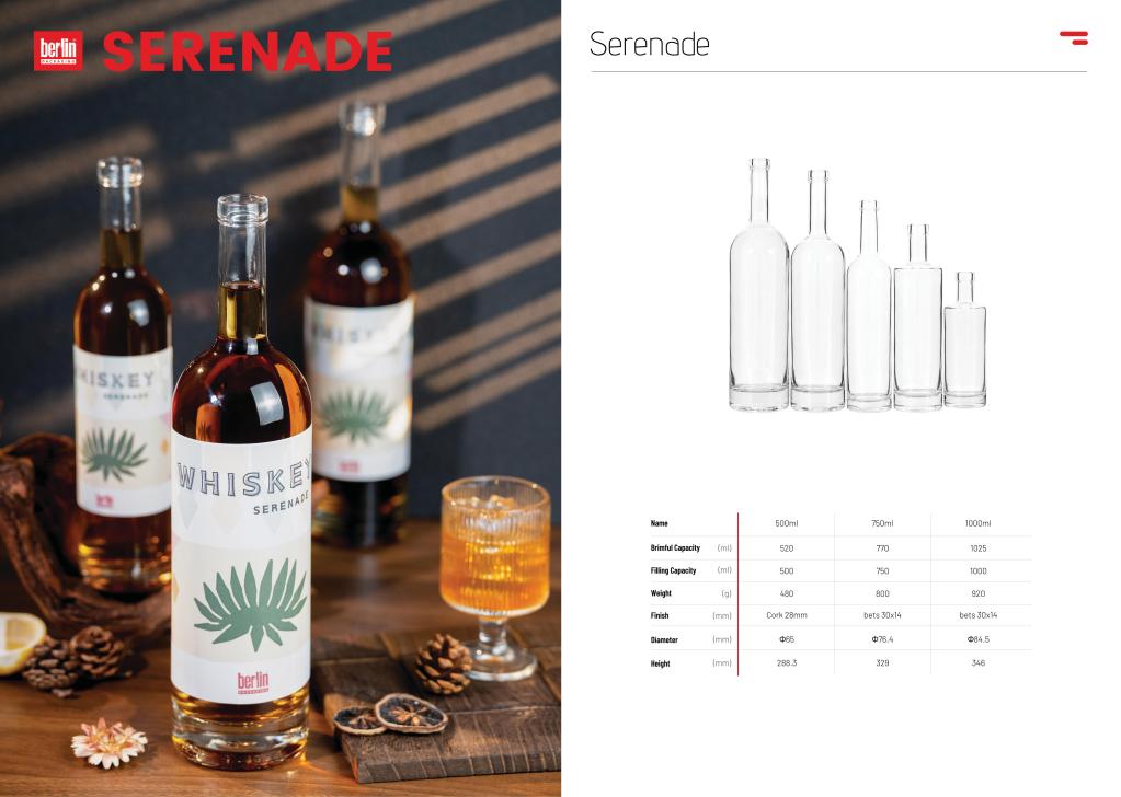 Berlin Packaging Serenade high-flint glass whiskey bottles with green leaf label displayed on wooden table next to technical specification catalog