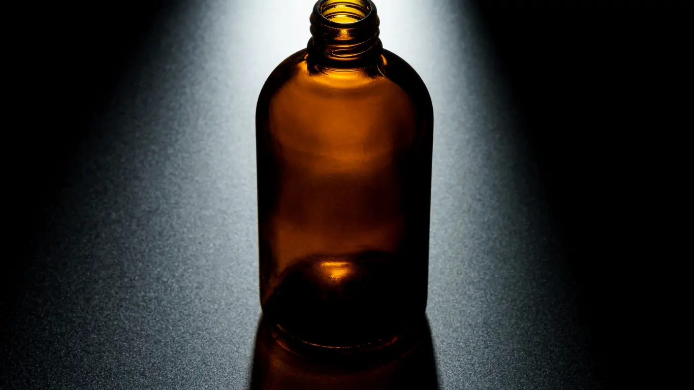 Amber glass dropper bottle with black rubber bulb and glass pipette for essential oils