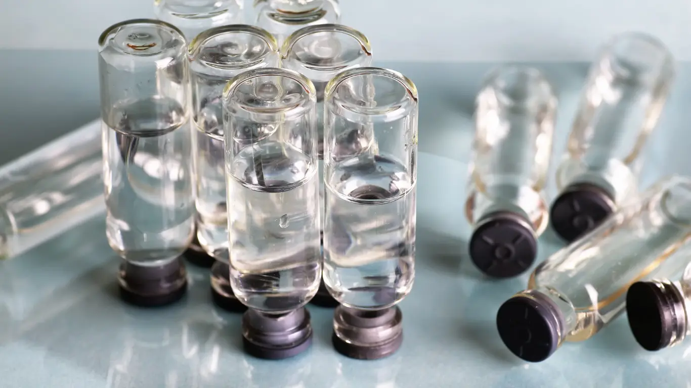 clear glass medical vials filled with liquid for injectable products