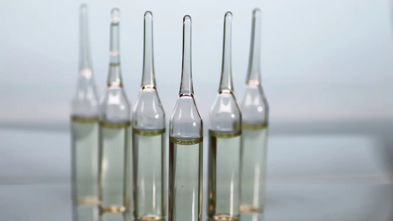 glass ampoules in a row for pharmaceutical and cosmetic serums