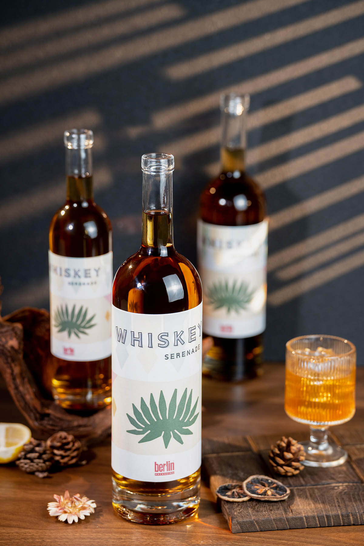 Serenade whiskey bottle with texts "HISKEY", "WHISKE" (missing Y), "SERENADE", and "berlin", showing partial truncation.